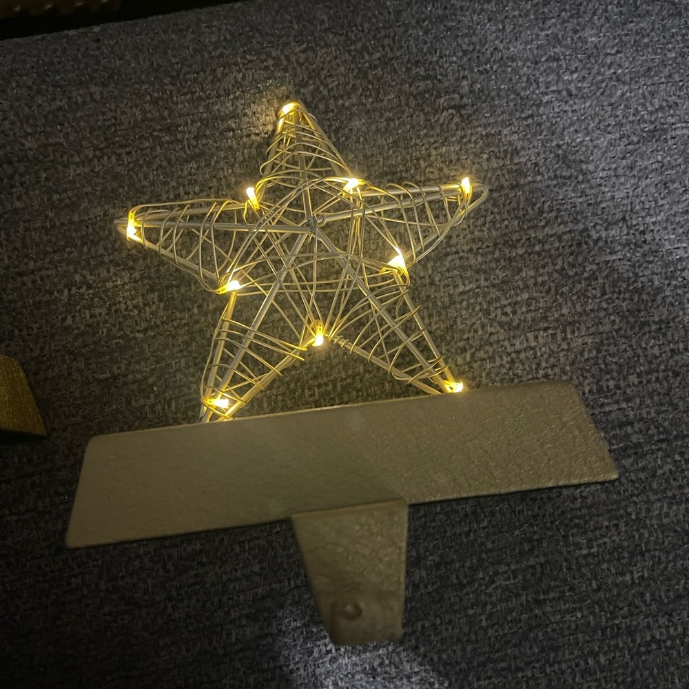 Gold star light up stocking holder. Has an on/off/timer switch.